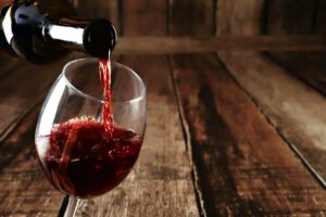 Pouring red wine into glass